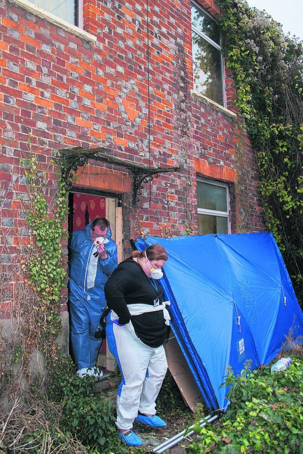 Police forensic investigators at the house in Cowley Road, Littlemore, last year