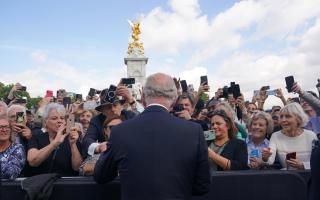 King Charles III is greeted by well-wishers during a walkabout to view tributes left outside Buckingham Palace, London, following the death of Queen Elizabeth II on Thursday.
