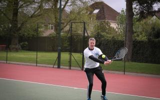 Tennis player on court in Oxford.
