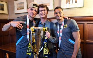 Mark Harris, the Oxford Mail’s sports reporter Liam Rice, and Josh Murphy with the League One play-off final trophy