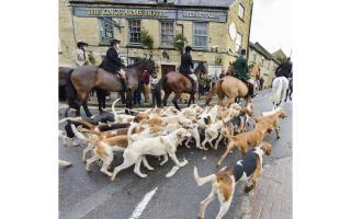The Heythrop Hunt moves off from the Fox pub in Chipping Norton after its Boxing Day meet