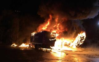 PICS: Dramatic images show raging fire rip through lorries
