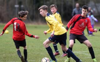 IN A SPIN: Hinksey Park’s Poldi Czermark (left) is sent the wrong way by the run of Liam Jones during his side’s 1-0 defeat by Bodicote Sports in the Under 13 Winter/Spring B League Pictures: Richard Cave