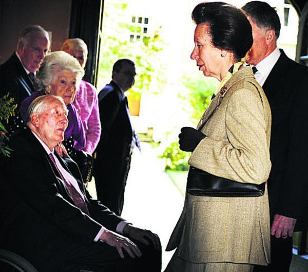 Princess Anne talks to Sir Roger Bannister and his wife Lady Moyra on arrival at Harris Manchester College