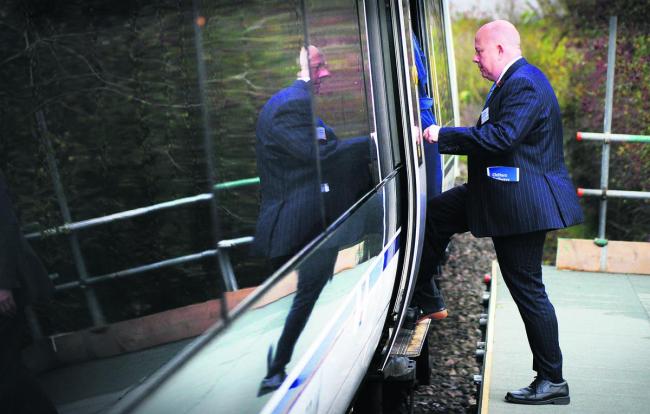 County council leader Ian Hudspeth steps on to the train