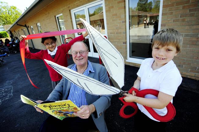 Children’s author Korky Paul celebrates the opening of the new classrooms with pupils Robert Challis, eight, and Sameeya Khan, eight