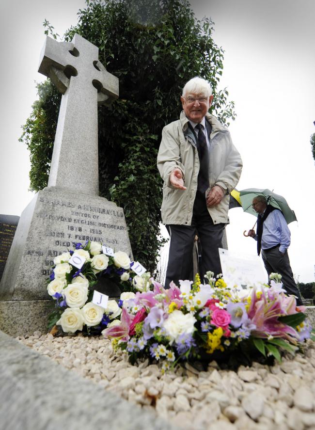 Poignant: Sir James Murray’s great-grandson Oswyn Murray lays a wreath on behalf of the family