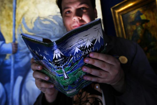 Precious weekend: Chairman of the Tolkien Society Shaun Gunner with a rare first edition of The Hobbit