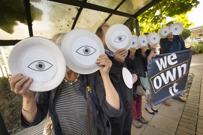 Eyes front: Campaigners from We Own It protest against the Transatlantic Trade and Investment Partnership