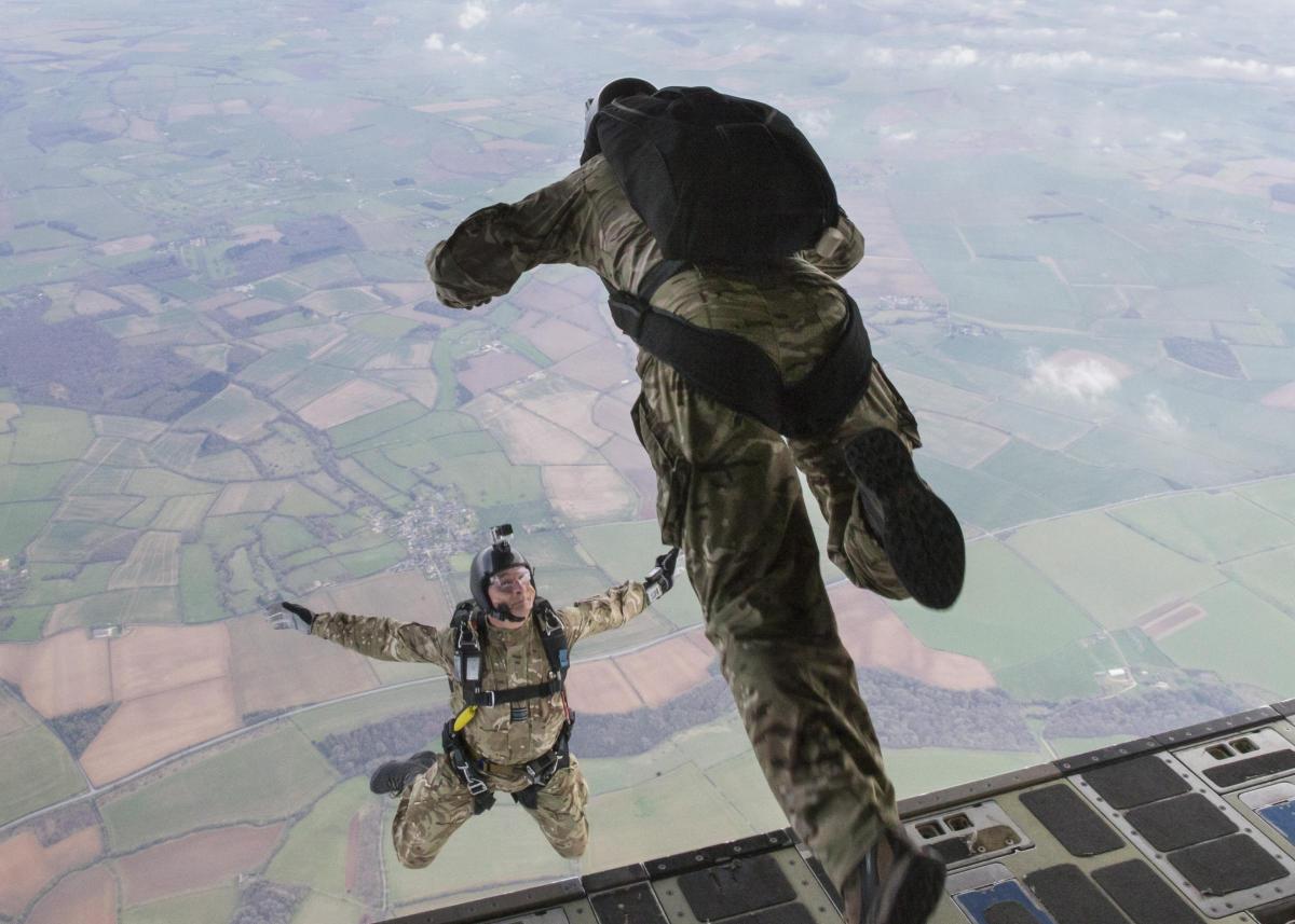 Airmen leap from plane as part of new trial of military freefall parachuting