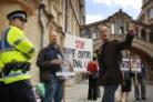 Mel Broughton of Speak leads the protest near the Sheldonian Theatre
