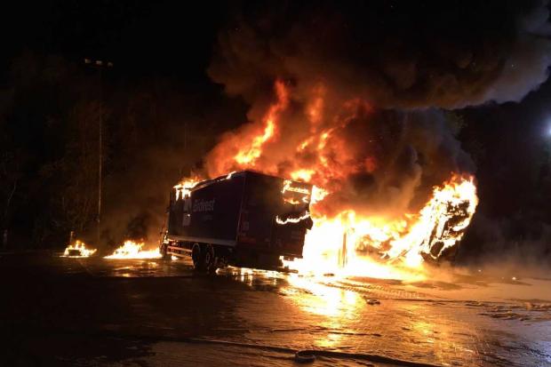 PICS: Dramatic images show raging fire rip through lorries