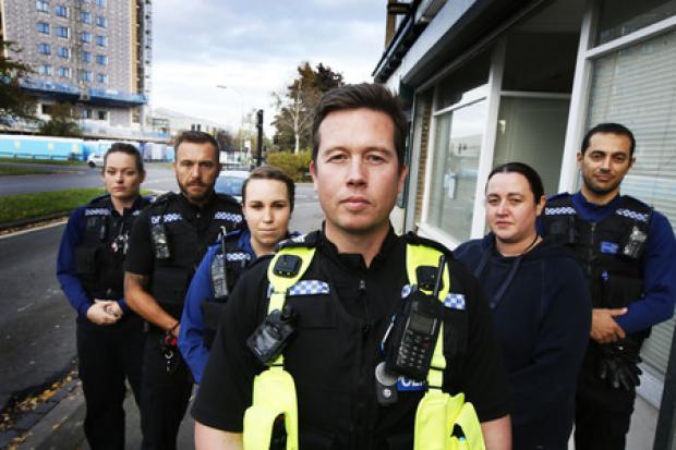 The north east Oxford neighbourhood policing team, with Sgt Andrew Poole (centre in hi-vis) outside their office in Northway, Marston. Picture by Ed Nix.