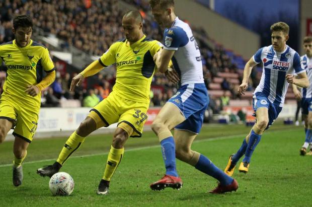 Gino van Kessel holds off a challenge against Wigan Athletic  Picture: Richard Parkes