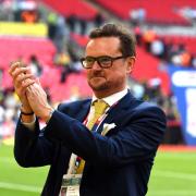 Oxford United chief executive Tim Williams celebrates at Wembley