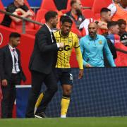 Oxford United boss Des Buckingham gives instructions to Marcus McGuane before he takes to the field at Wembley